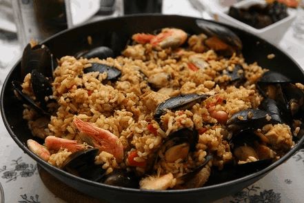 Paella, a traditional dish of Spain, containing shrimp, fish and rice